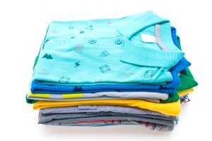 Colorful Stack of T Shirt and Polo isolated on white background